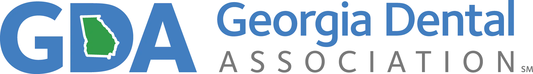 The image shows a logo with text that reads  GDA Georgia Dental Association  along with the acronym  GDA  in stylized lettering, set against a light background with a darker border.