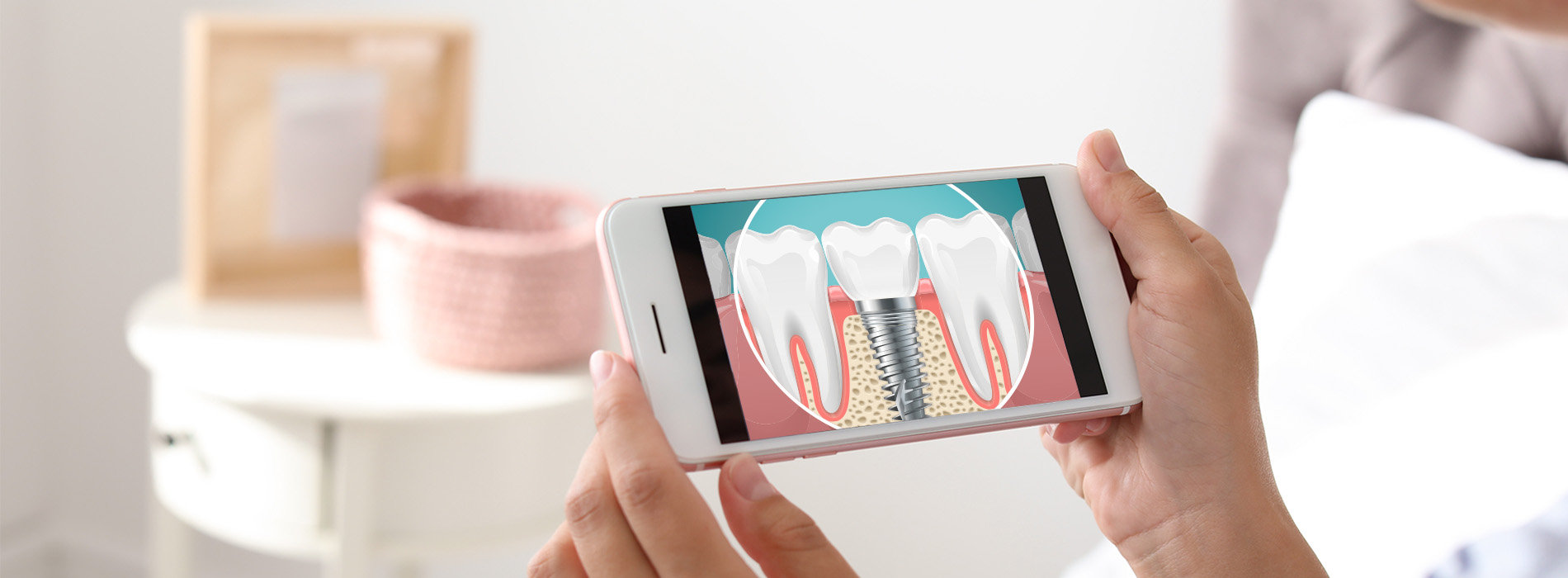The image shows a person holding a smartphone displaying an app with images of teeth and toothbrushes, suggesting dental hygiene or oral health care.